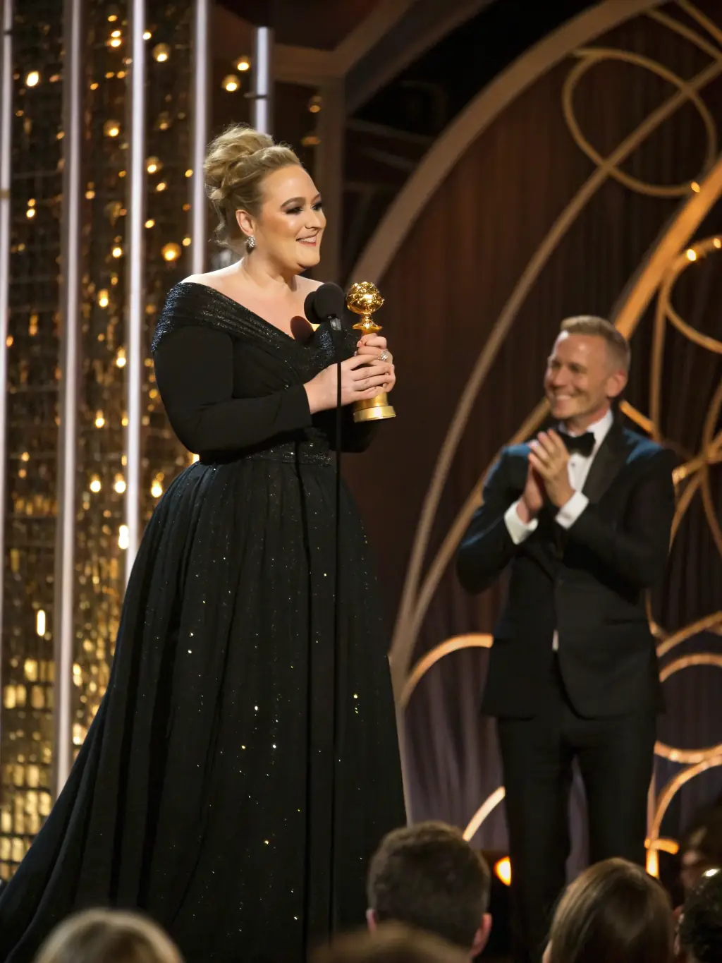 A photo of a celebrity receiving an award, highlighting their achievements and recognition in the entertainment industry, suitable for NewsInNetwork.